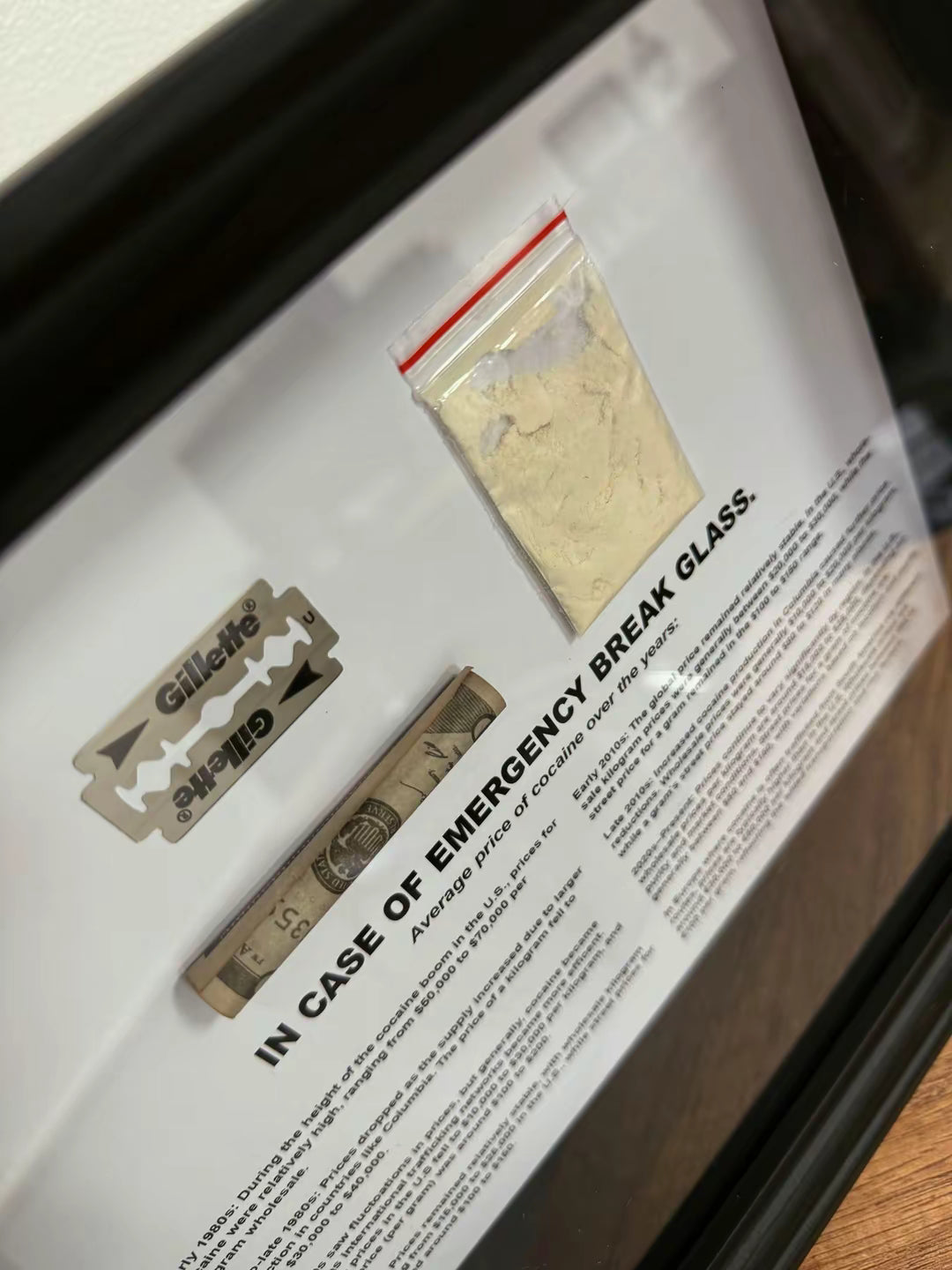 Close-up of object100™ Emergency C0C A1 NE Dollar Frame with premium acrylic display