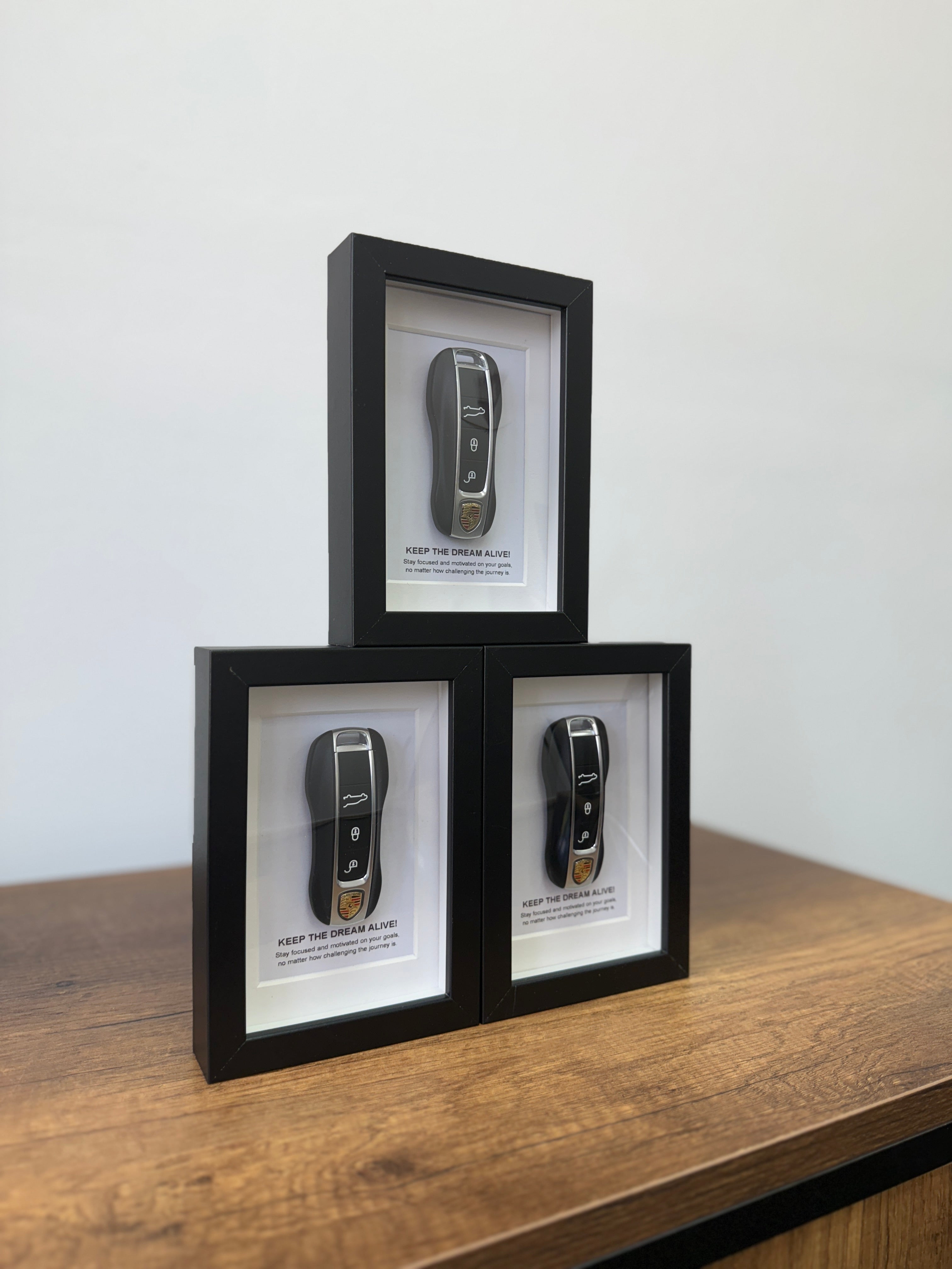 Three object100™ Keep The Dream Alive limited edition framed artworks displayed together