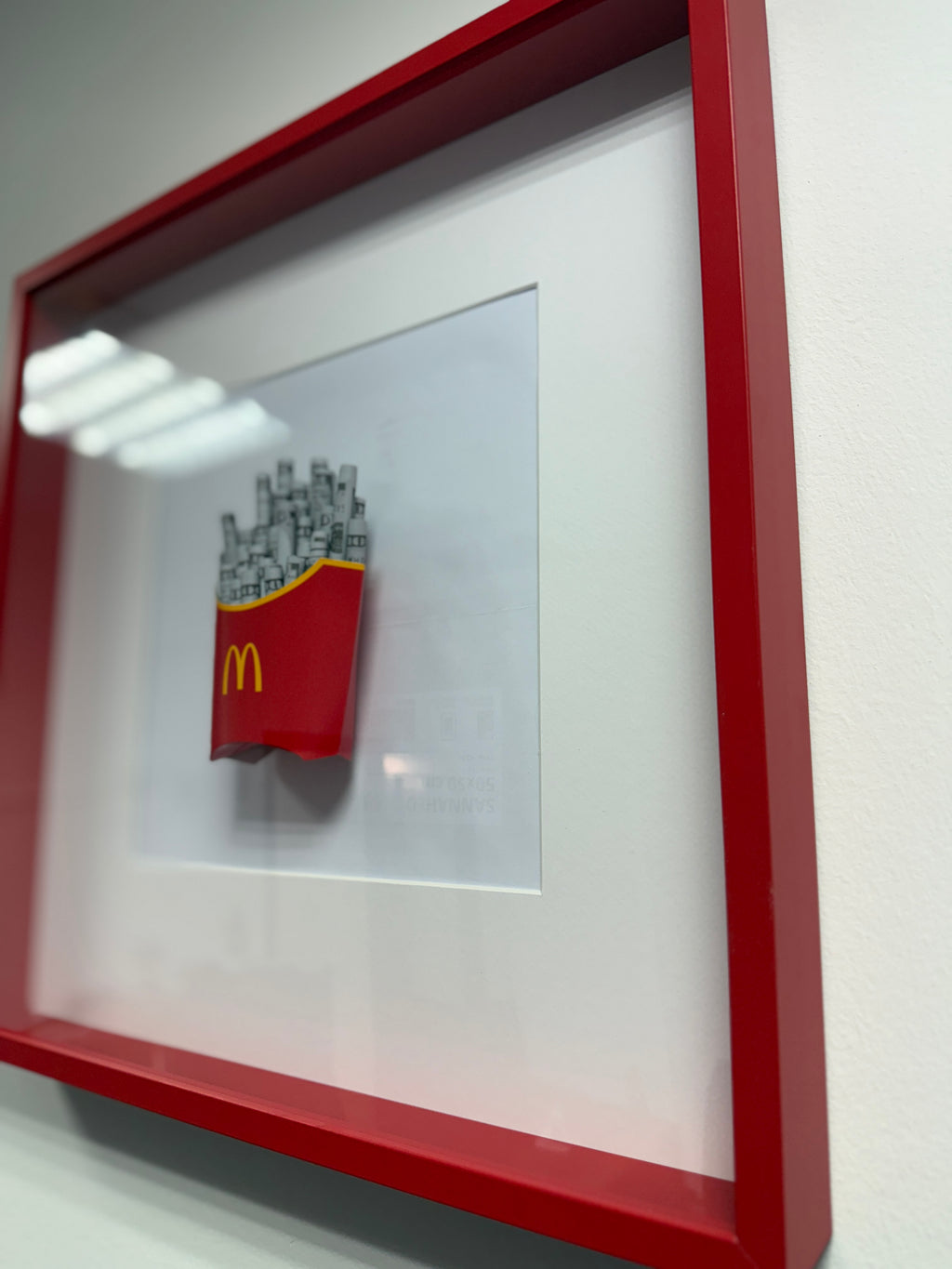 Angled view of object100™ Stay Hungry Frame in premium red wooden frame